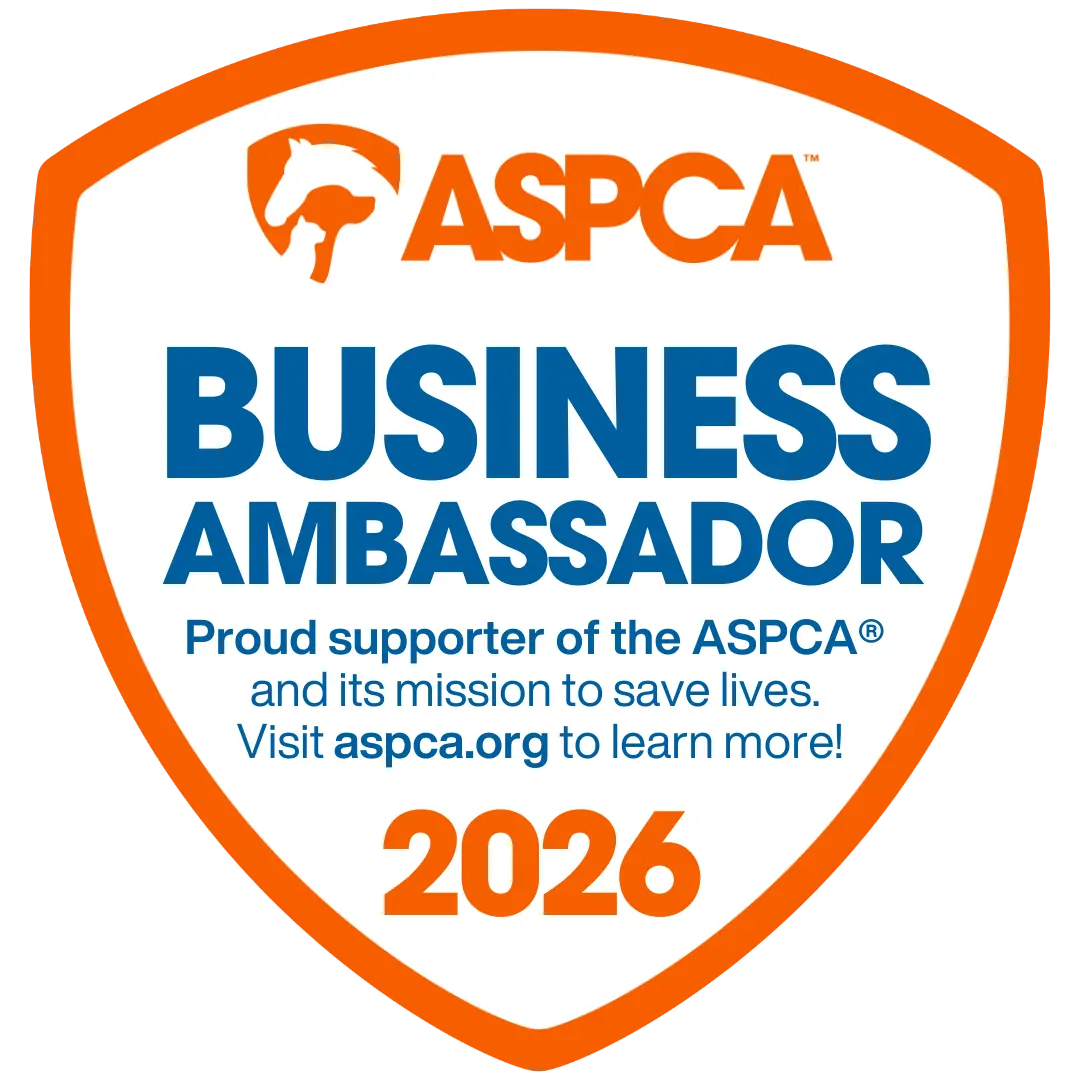 A white, orange, and blue digital badge reading: "ASPCA Business Ambassador 2026. Proud supporter of the ASPCA."